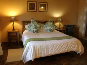 Postel nebo postele na pokoji v ubytování Sandforest Cottages