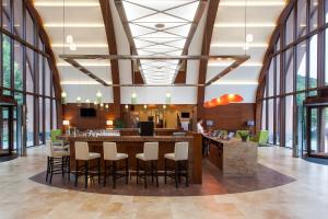 a large lobby with a bar and chairs at Grand Resort Jermuk in Jermuk