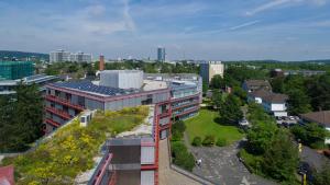 an aerial view of a building with a garden at Wissenschaftszentrum Bonn in Bonn