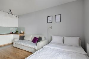 Postel nebo postele na pokoji v ubytování ApartHouse Deluxe