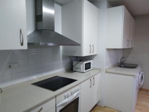 Una cocina o zona de cocina en Precioso apartamento con terraza