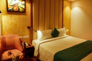 Postel nebo postele na pokoji v ubytování Nemesia City Center - Gurugram, Sector 29