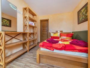 a bedroom with a bed and a book shelf at Ferienwohnung Lotse in Schaprode