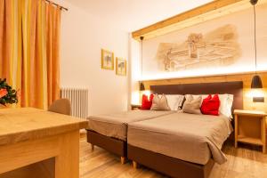 Posteľ alebo postele v izbe v ubytovaní Residence Hotel Santa Maria piscina e wellness