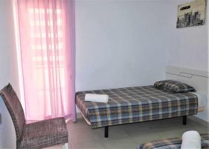 Postel nebo postele na pokoji v ubytování Apartamento 1E 2 dormitorios