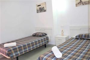 Postel nebo postele na pokoji v ubytování Apartamento 1E 2 dormitorios