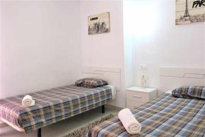 Postel nebo postele na pokoji v ubytování Apartamento 1E 2 dormitorios