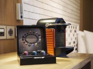 a radio sitting on top of a table at AMOY by Far East Hospitality in Singapore