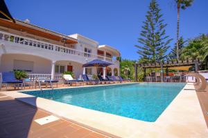 a villa with a swimming pool in a resort at Casa Monte Cristo Apartments - Orange in Lagos