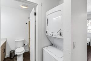 a white bathroom with a sink and a toilet at Beautiful Ski-in Ski-out Condo Located On The Eagle Point Resort! condo in Beaver