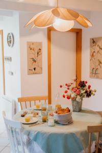 a table with a bowl of food on it at Gîtes du Bulz, en pleine forêt proche de la mer in Pleyber-Christ