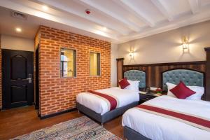 Voodi või voodid majutusasutuse Hotel Pabera Heritage Boutique toas