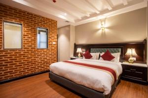 Voodi või voodid majutusasutuse Hotel Pabera Heritage Boutique toas