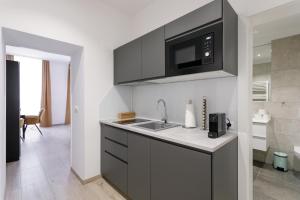 Kuchyň nebo kuchyňský kout v ubytování WF-Apartment Westbahnhof + 37 fotografií