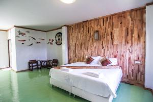 Postel nebo postele na pokoji v ubytování My Place Mae Salong