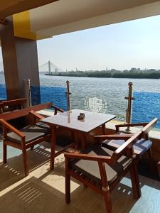 a table and chairs on the deck of a boat at Nile Transport Hotel in Cairo