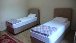 two beds sitting next to each other in a room at Trabzon Star Pension in Trabzon