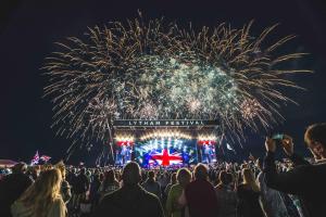 a crowd of people watching fireworks at a festival at St Annes Lodge Apartments, Lytham St Annes in Lytham St Annes
