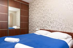 Postel nebo postele na pokoji v ubytování Apartments Chełmońskiego Warsaw Ursus by Noclegi Renters