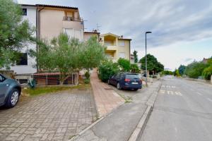 a car parked on the side of a street at Lovely apartment few minutes from the beach in Štinjan