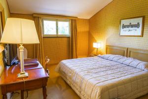 Hotel Villa La Principessa tesisinde bir odada yatak veya yataklar