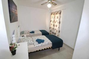 Posteľ alebo postele v izbe v ubytovaní Mare Verde B90 by Tenerife Rental & Sales