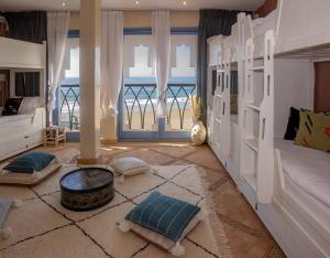 a living room with a view of the ocean at TEDDY PIRATE - Coliving in Taghazout
