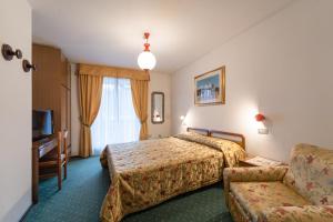 Lova arba lovos apgyvendinimo įstaigoje Hotel Torretta