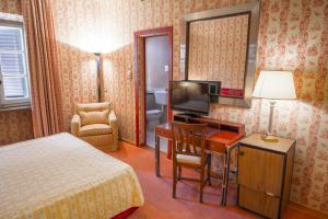 TV a/nebo společenská místnost v ubytování Hotel Villa La Principessa