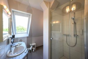 a bathroom with a sink and a shower at Gut Vorbeck in Gneven +38 photos