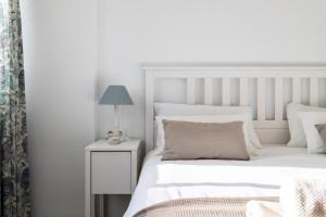 Posteľ alebo postele v izbe v ubytovaní Sur Suites Perla 6-4