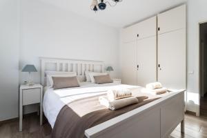 Posteľ alebo postele v izbe v ubytovaní Sur Suites Perla 6-4