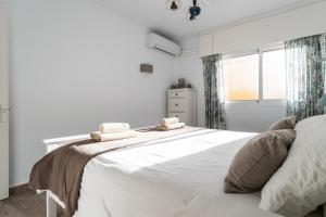Posteľ alebo postele v izbe v ubytovaní Sur Suites Perla 6-4