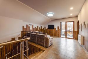 a large room with wooden walls and wooden floors at 10 KEYS Boutique Hotel in Borjomi