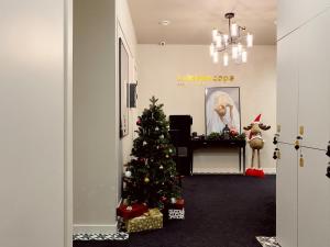 a christmas tree in the middle of a hallway at Kaleidoscope Central in Saint Petersburg