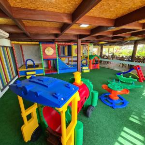 a play room with many different colored play equipment at Pousada Coqueiro Beach in Luis Correia