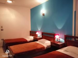 Postel nebo postele na pokoji v ubytování Al Hambra Hotel + 36 fotografií