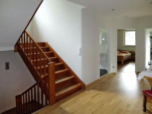 a wooden staircase in a living room with a bedroom at Holiday Home Viola by Interhome in Sankt Martin am Grimming +34 photos