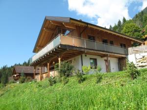 a house on the side of a hill at Apartment Corona - RMU185 by Interhome in Ramsau am Dachstein