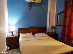 Postel nebo postele na pokoji v ubytování Al Hambra Hotel
