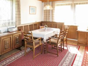 a dining room with a table and chairs at Apartment Lassnig - ARR101 by Interhome in Arriach