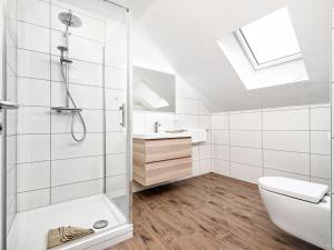 a bathroom with a shower and a toilet and a sink at Apartment Deutschbauer - FAK101 by Interhome in Egg am Faaker See