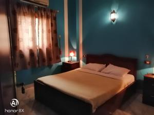 Postel nebo postele na pokoji v ubytování Al Hambra Hotel