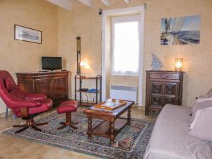 a living room with a couch and a coffee table at Holiday Home Ty Tan-Nie by Interhome in Quiberon