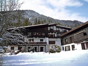 a large building with snow in front of it at Apartment Les Charmoz-2 by Interhome in Chamonix-Mont-Blanc