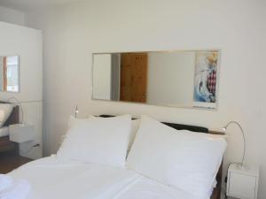 Postel nebo postele na pokoji v ubytování Apartment Chesa Piz Cotschen 2 by Interhome