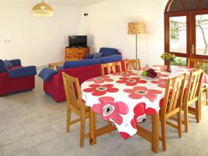a living room with a table and a couch at Holiday Home Julija - VOD300 by Interhome in Pirovac