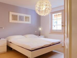 Postel nebo postele na pokoji v ubytování Apartment Obri Tuftra-4 by Interhome