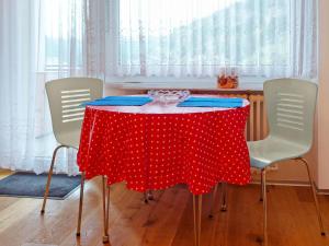 a table with a red polka dot table cloth at Apartment Viscaria-2 by Interhome in Zermatt