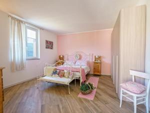 Tempat tidur dalam kamar di Apartment Nonna Nina by Interhome